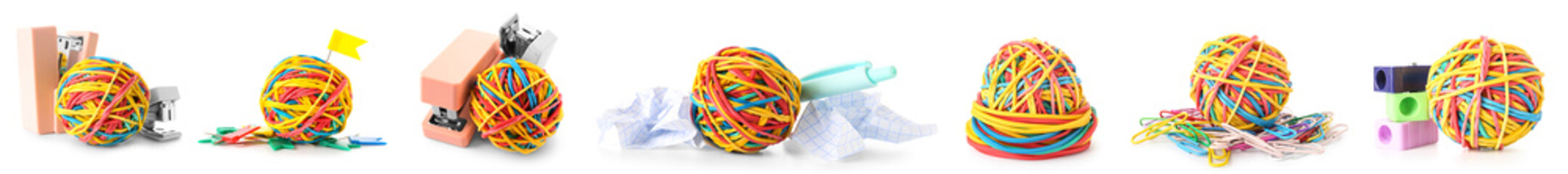 Collection of colorful rubber band balls with office supplies on white background