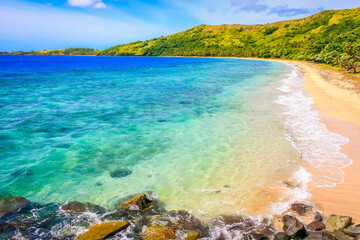 Tropical sandy beach at summer day in Fiji Islands, Pacific ocean