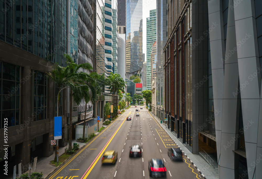 Wall mural street and car on traffic moving in downtown business financial district with skyscraper building in