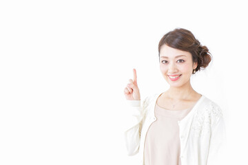 Fototapeta premium 指をさすおしゃれ着の女性