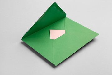 Green envelope on grey background