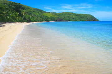 Tropical sandy beach at summer day in Fiji Islands, Pacific ocean