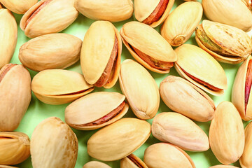 Delicious pistachio nuts as background