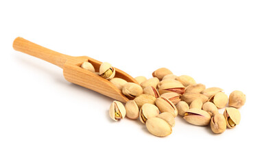 Tasty pistachio nuts and scoop isolated on white background