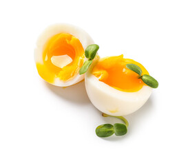 Soft boiled eggs with micro green on white background