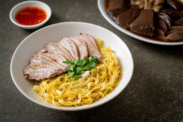 dried duck noodles in white bowl
