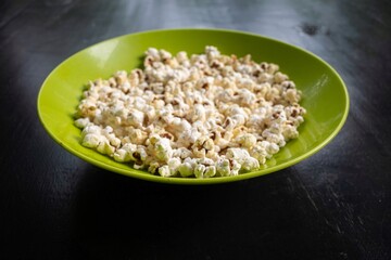 Popcorn is a type of confectionary made from corn kernels that are heated until they explode