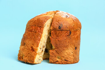 Cut Panettone on blue background