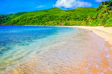 Tropical sandy beach at summer day in Fiji Islands, Pacific ocean