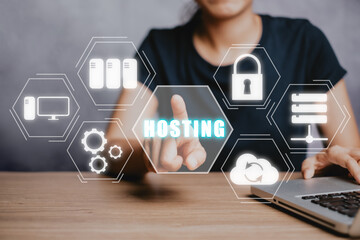 Web hosting concept, Woman using computer and presses his finger on the virtual screen inscription Hosting on desk, Internet, business, Technology and network concept.