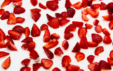 strawberry pieces on white cream, cake decoration