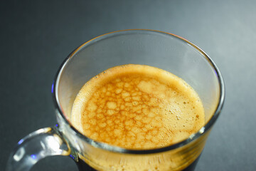 hot black coffee on black table, beverage in the morning