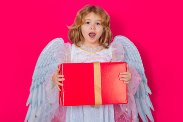 Cute child angel with gift box present. Valentine angel. Little cupid child. Kid angel with angels...