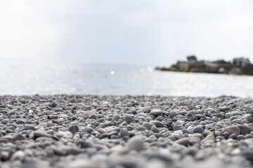 Rocky coastline. in Camogli, a fishing village and resort close to the peninsula of Portofino, in the Riviera di Levante, Genoa Liguria Italy. Tropical sea nature background.