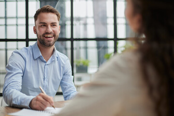 Fototapeta premium business man sitting at his desk in the office