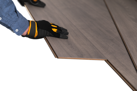 Installation of floating floor, handyman putting laminate. Home improvement concept. Removed underlayer