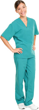 Medical nurse isolated in full body length in green scrubs on pure white background. Multiracial Asian and Caucasian female medical professional doctor or nurse smiling happy and joyful

