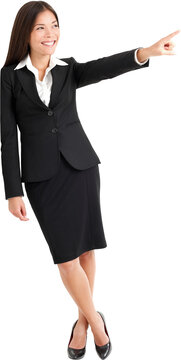 Full length of young businesswoman pointing at copyspace isolated on white background. PNG, transparent isolated cutout, Can be superimposed on other image or background.
