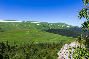 Summer, mountainous terrain, hiking trails running through the park, a place for walking and...