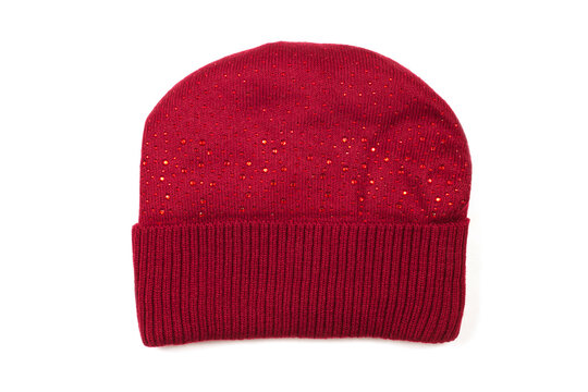 Woolen knitted hat on a white background. Red women's hat.