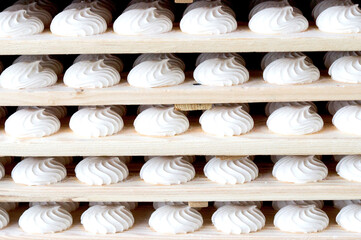 White color marshmallow lies on pallets at the factory