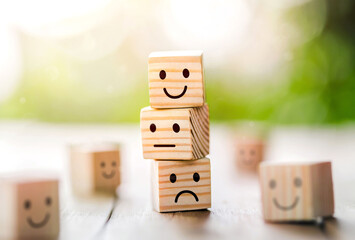 Wooden cube block shape with icon face smiley, The best excellent business services rating customer...