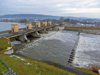 Aerial view. Dam, rushing river, water, landscape, nature, street, bridge, winter.