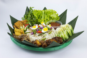Nasi Liwet Sunda. A traditional Sundanese rice dish of white rice cooked with spices and topped...