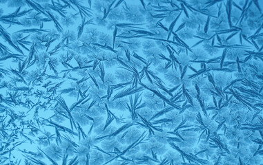 frost crystal on window glass in winter season