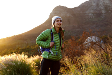 Naklejka premium Portrait of smiling female caucasian hiker in winter clothes
