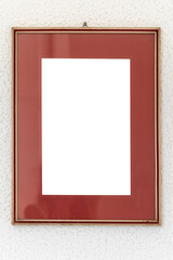 Old wooden Image frame decorated with gold on a white textured wall. Photo frame with clean copy space for your content.