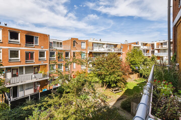 an apartment complex with trees and bushes in the foreground area, melbourne, australia photo by...