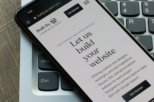 Portland, OR, USA - Jan 1, 2023: Website homepage of Built By WordPress, a Wordpress.com web design service, is seen on a smartphone.