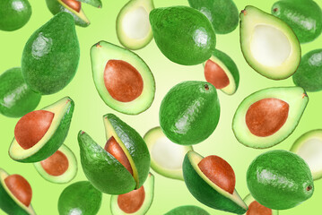 Levitation of avocados on a green background.