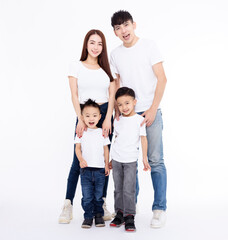 Fototapeta premium Happy Asian family standing together on white background