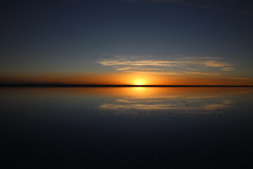 Fototapeta premium Sunset over Uyuni salt lake in Bolivia