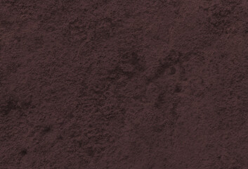 暗い赤茶色の凸凹した土のテクスチャー
