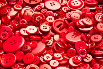 background of a variety of red buttons 