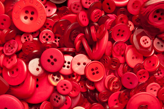 background of a variety of red buttons 