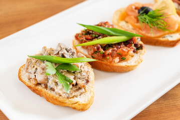 tasty canape on the wooden background