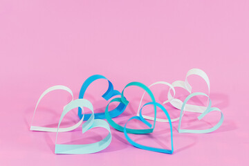 Love hearts on pink background.