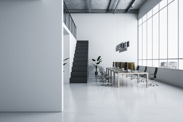 Front view on blank grey wall in stylish open space office with modern computers on wooden table, light glossy floor, dark stairway and city view background from panoramic window. 3D rendering, mockup