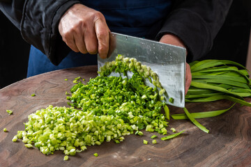 A Chinese chef is making cut vegetables, photographed in Shandong, China