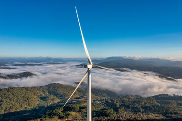 PANORAMIC VIEW OF WIND FARM OR WIND PARK, WITH HIGH WIND TURBINES FOR GENERATION ELECTRICITY WITH COPY SPACE. GREEN ENERGY CONCEPT, CAU DAT, DA LAT, VIETNAM