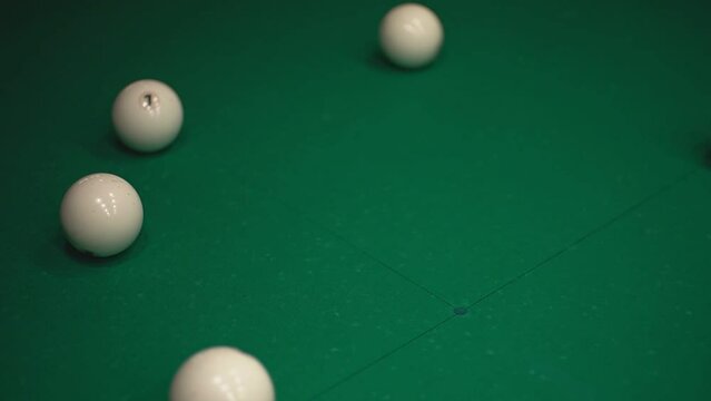 a man tries to break the pyramid correctly in billiards. High-quality FullHD video recording. real-time video