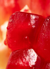 Juicy red pomegranate berries as background.