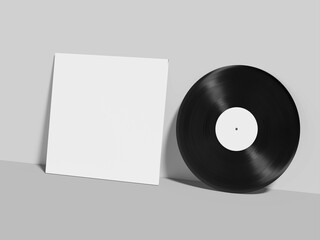 Vinyl Mockup and Cover Leaning Against a Background of Clean White Walls and Flooring High-angle...