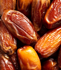 Juicy dried dates as background.