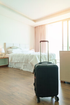 Black Luggage In Modern Hotel Room After Door Opening. Baggage For Time To Travel, Service, Journey, Trip, Summer Holiday And Vacation Concepts