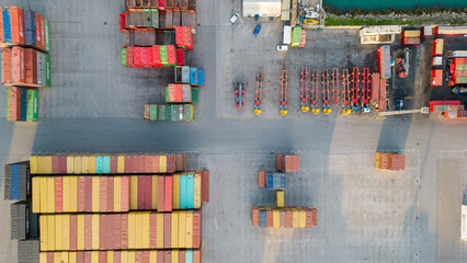 Aerial image of logistics platform with containers to import and export materials by ship	